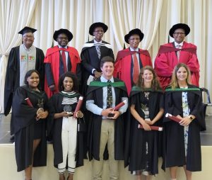 Front row left to right: Engela Uithaler, Nominqwene Nonjola, Cameron Moodie, Karli du Toit and  Britteney Havenga.Back row: Left to right: Darrel Jacobs (Deputy Director-General Agricultural Development Support Services; Dr Mogale Sebopetsa, Head of Western Cape Agriculture;  Mr Mooketsi Ramasodi, Director-General Department of Agriculture, Land reform and Rural Development; Dr Ivan Meyer, Western Cape Minister of Agriculture; and Dr Harry Malila, Director-General Western Cape Government.