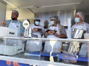 Minister Meyer and Dr Mogale Sebopetsa displays freshly made sausage and patties