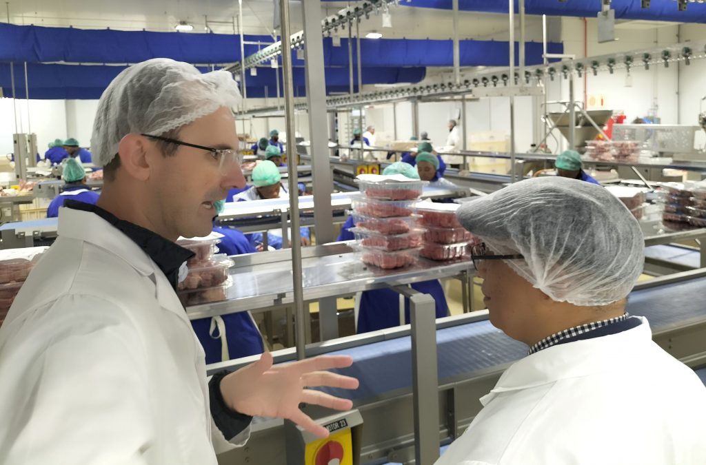 Hendri Truter showing Minister Meyer the meat processing facility